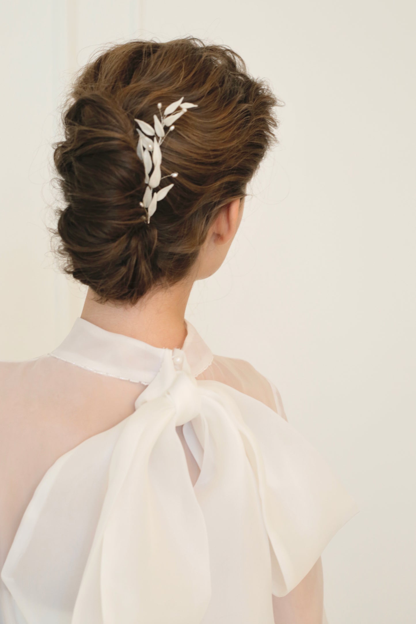Headpiece with white leaves for bride