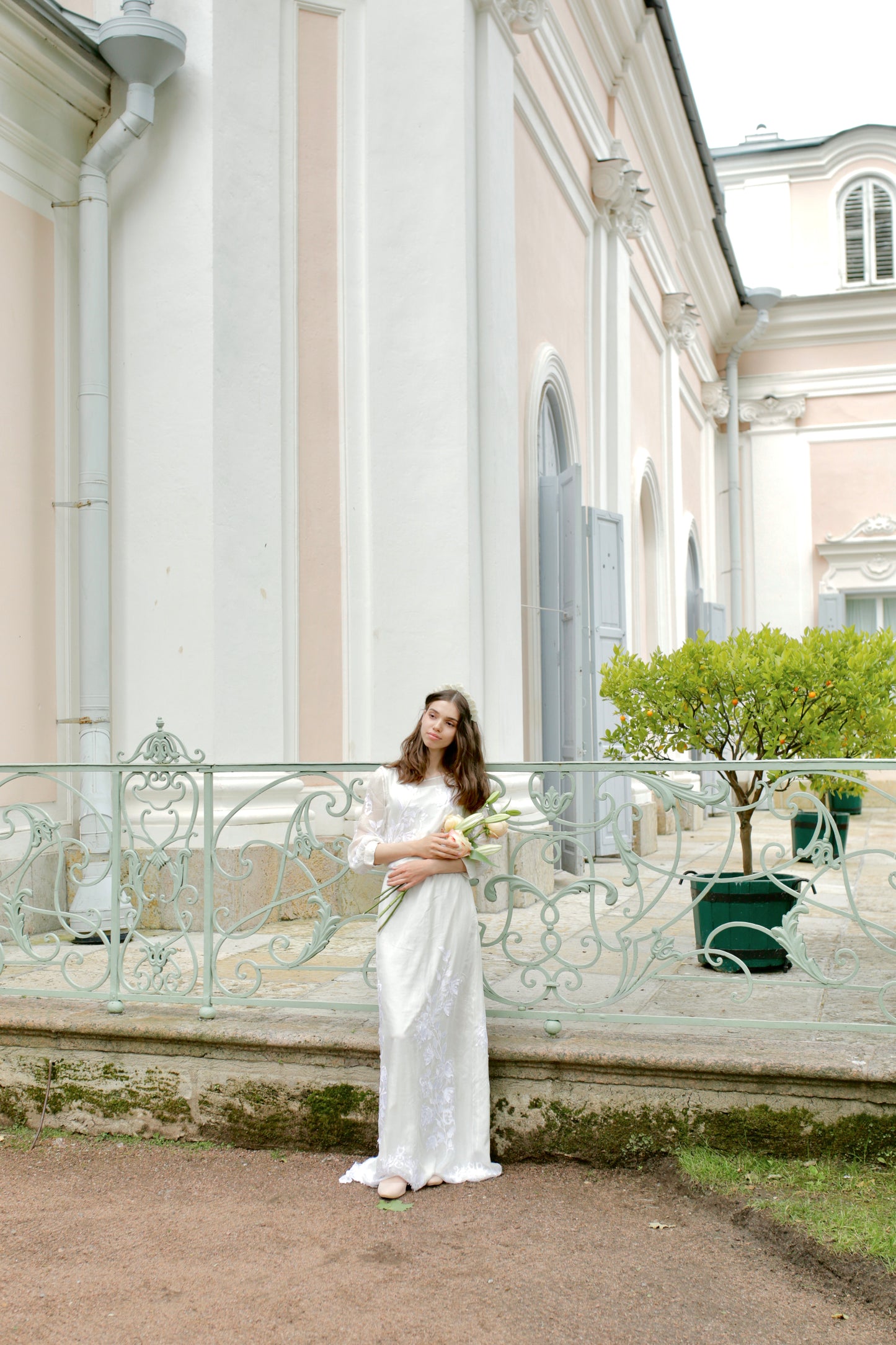 Bridal headdress made by designer for wedding ceremony with white flower petals