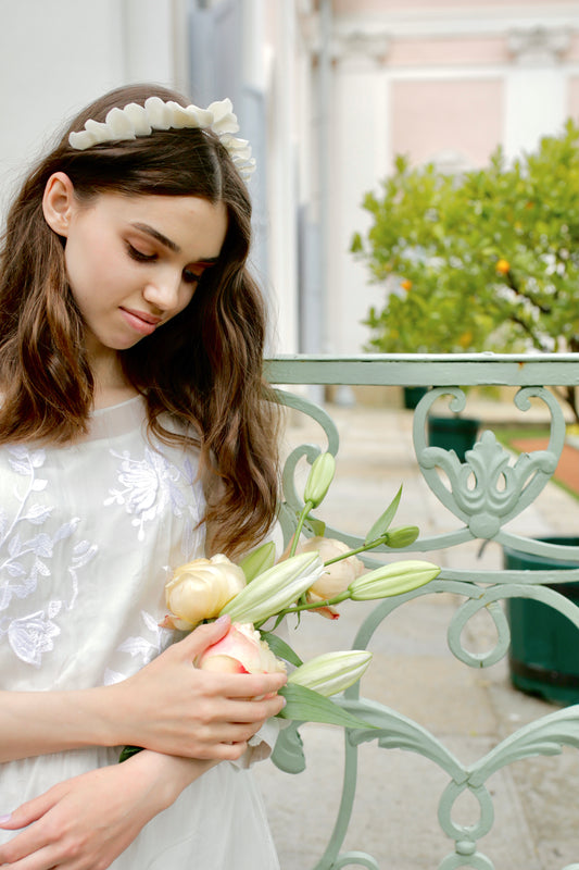 Wedding halo in classic style with white porcelain petals on a crown or bridal hairstyle